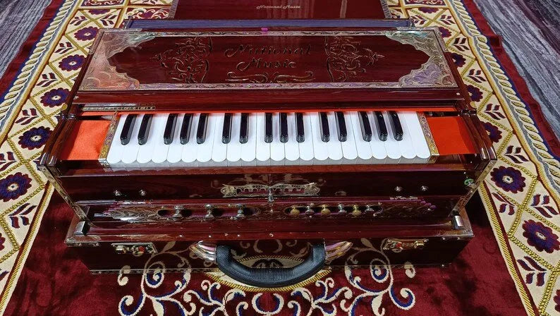 national music walnut brown harmonium front view highlighting the Italian keys