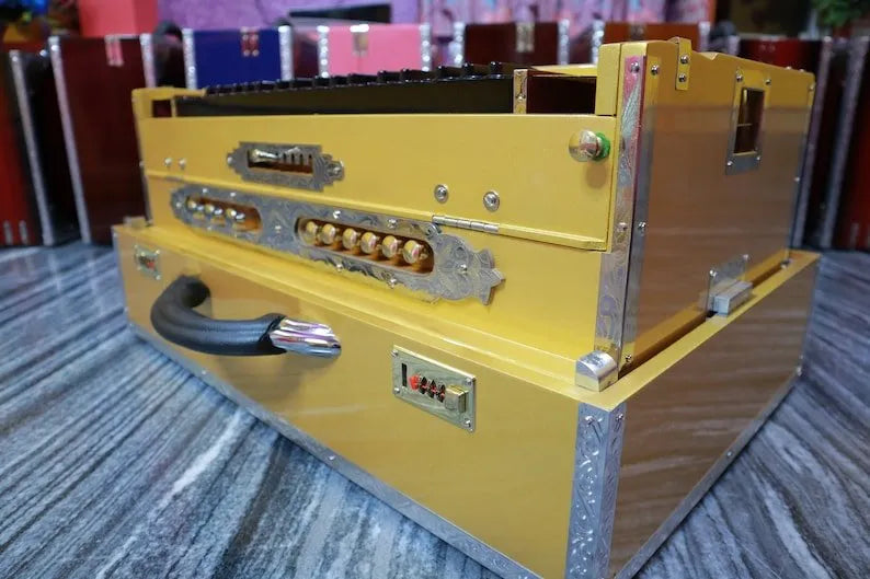 highlighting the steel decoration on golden 3 Line 9 Scale Changer Harmonium with Built-in Shruti Box - National Music India
